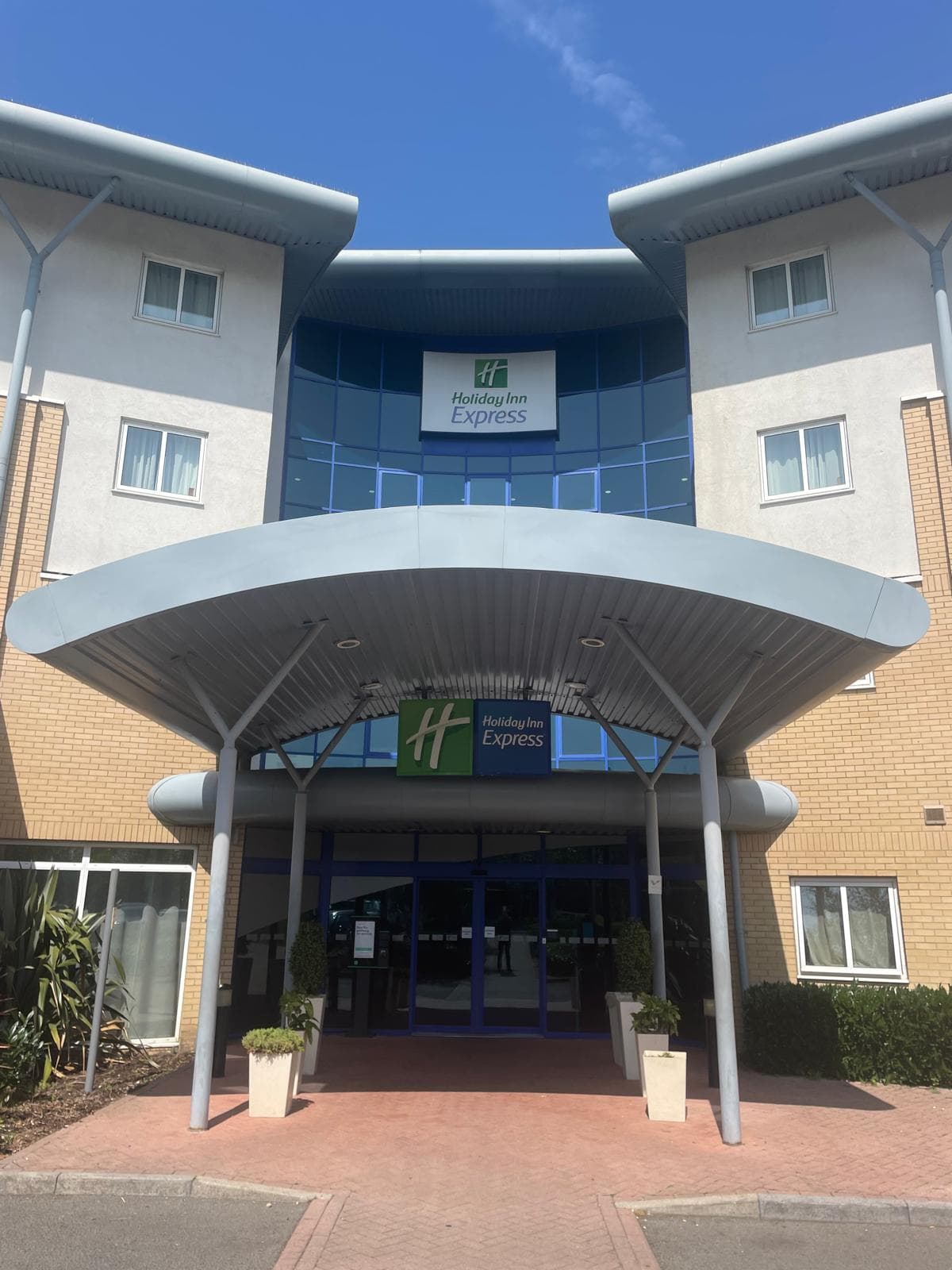 The entrance canopy of the Holiday Inn Express Nottingham on a clear day